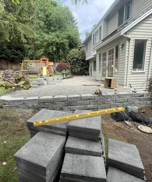 Installation of pavers. Retaining wall. Children's play area and installation of lights in Snohomish 